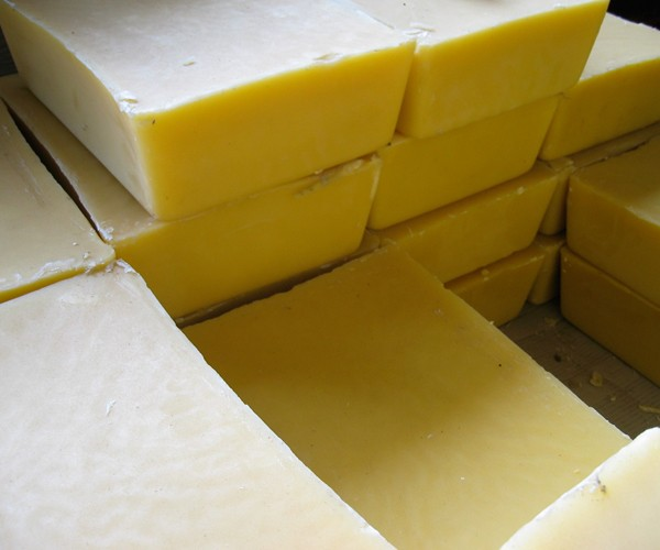 Refined beeswax blocks packaged for distribution