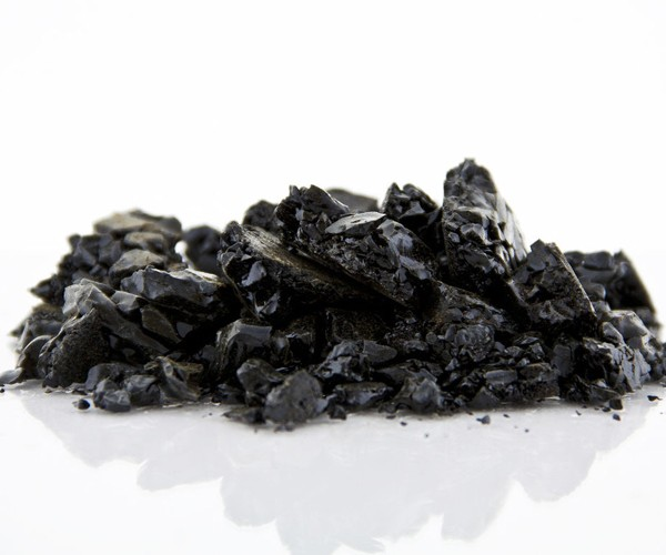 Purified propolis chunks on white background